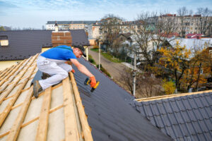 roofing blue ox man working