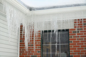 Ice build up gutters roofing company repair needed